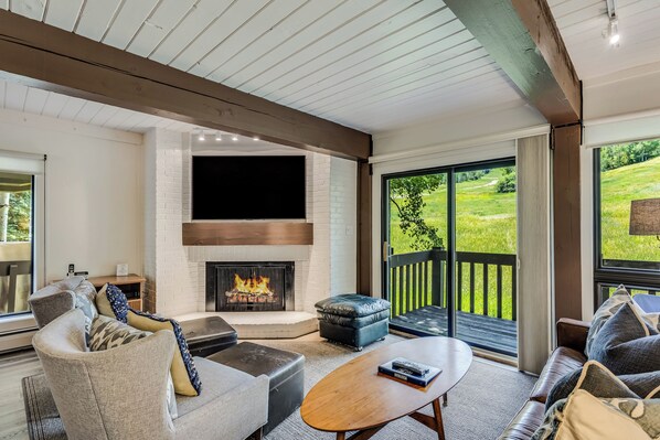 Living room with wood-burning fireplace