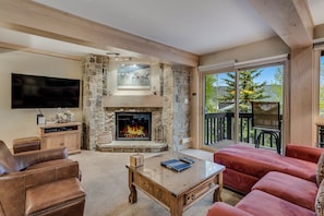 Living room with wood-burning fireplace