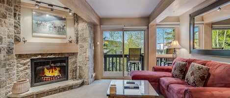 Living room with wood-burning fireplace