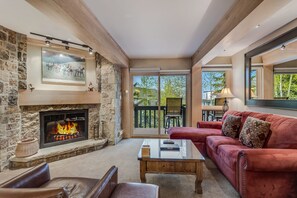 Living room with wood-burning fireplace