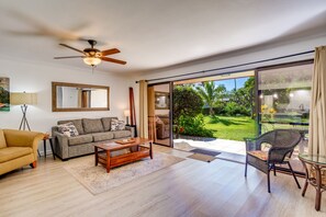 Lanai connects to garden area with the pool steps away.