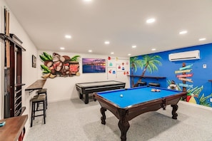 Incredible Game Room with Pool Table, Air Hocky, Retro Arcade & 65" Samsung TV