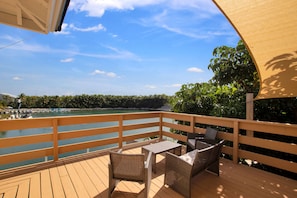 Upper deck seating area with shade where manatees can often be seen below