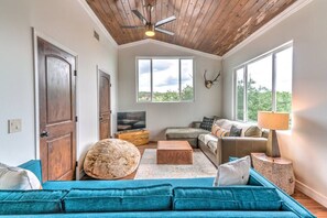 Living room off the open kitchen and dining area.