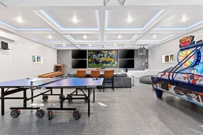 Sophisticated gaming meets historic charm in our versatile living space, perfect for leisure and laughter.