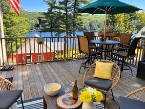 2 seating and dining areas on the deck with fantastic views of the lake