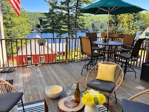 2 seating and dining areas on the deck with fantastic views of the lake