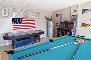 Fun games room with pool table, air hockey, foosball, two arcade machines