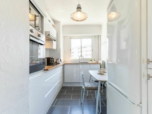 Cabinetry, Property, Countertop, Furniture, Window, Sink, Kitchen, Lighting, Wood