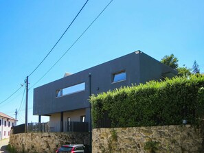Sky, Plant, Vehicle, Window, Building, Car, Slope, Wall