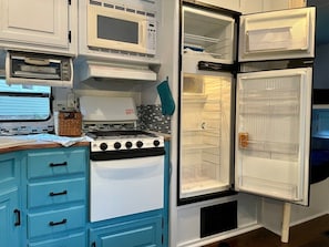 You’ll enjoy the full kitchen including fridge and freezer