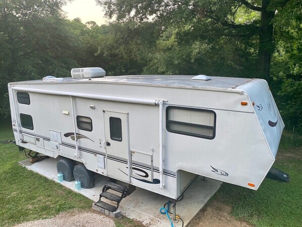 The Tiny Home is nestled right next to our forest with a path overlooking a creek