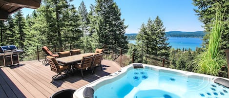 Spacious Deck with a Soothing Hot Tub, 8-seat outdoor table and Amazing Lake Views