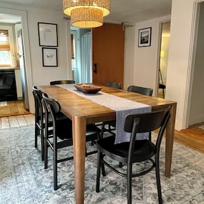 Dining room with large table and 6 chairs.