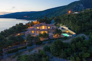 The villa and its surroundings aerial view.