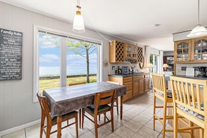 Well-stocked kitchen with views of the lake!