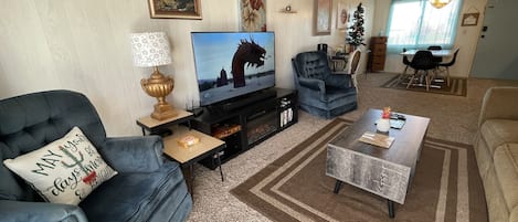 Tv, Electric Fireplace, DVDs, game console, and board games to enjoy