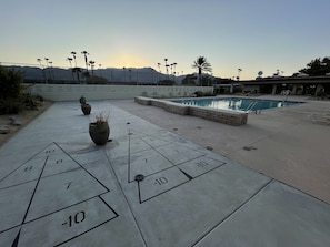 Shuffleboard next to the pool