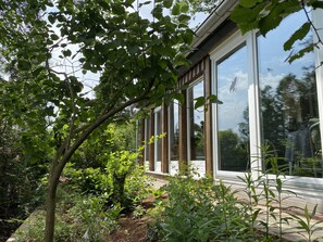 Ferienhaus Westseite, Wintergarten mit anschließendem Wohnzimmer