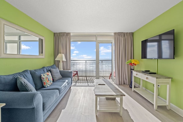 This oceanfront living room is the perfect place to relax with loved ones.