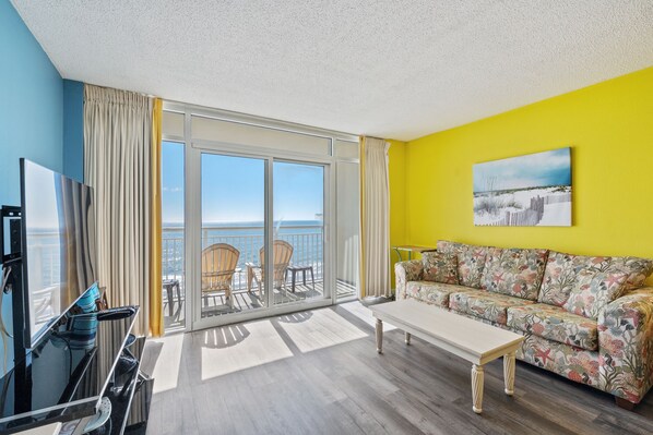 The ocean front living room is well-appointed with comfortable furnishings.