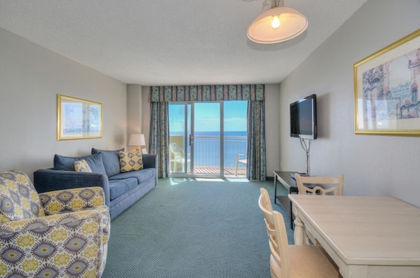Kick back for some movie time in this oceanfront living room.