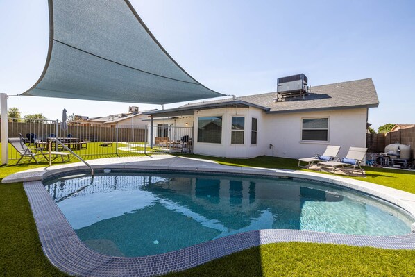 Glendale Keim - a SkyRun Phoenix Property - A sparkling play pool with shade structure perfect for the kids (and kids at heart) to cool off!