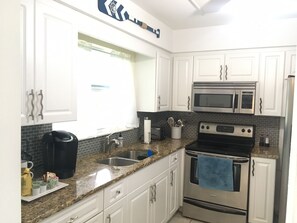 Bright open kitchen overlooking the beautiful backyard.