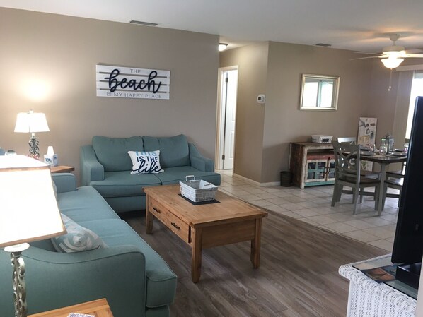 Entrance view. Living room and dining area.