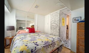 Queen bed in second bedroom with plety of natural light