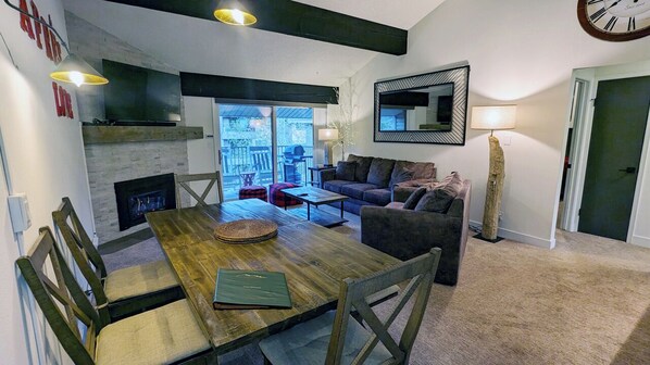Condo N-4 with dining table, gas fireplace,  and balcony with propane BBQ grill