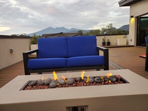 Two fire tables with comfortable seating