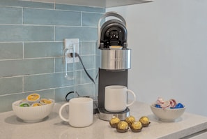 Fully stocked coffee bar with K Cups, creamer and treats. 