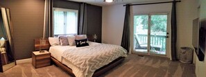 Ground level spacious master bedroom. Very comfy bed. Enjoy coffee on porch.