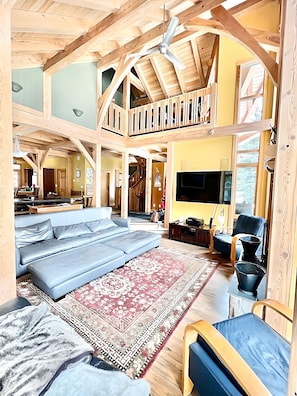 Living room with plenty of seating and large screen TV