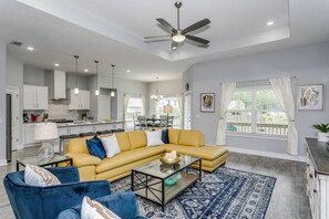 The large living room is open to the kitchen and dining room