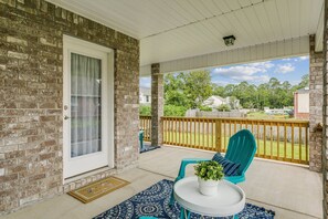 Enjoy morning coffee on the covered wrap around back porch