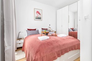 Enjoy the simplicity and comfort of the bedroom's modern design. 