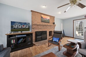 A cozy room to spend time in together (Fireplace decorative).