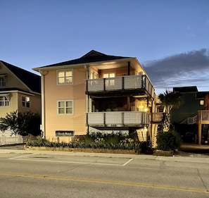 Exterior view at night.  Lights come on a dusk for safety.  Unit B  is upper. 