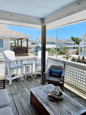 Great covered porch for reading, relaxing, having a cocktail or people watching 