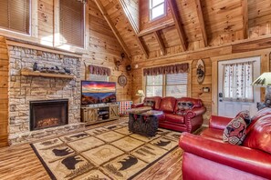 Open floorplan with vaulted ceilings and electric fireplace