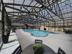 Community pool in a covered greenhouse structure. Available March-December!

