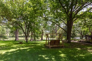 Enjoy your coffee, cocktails or tea in this wooden swing overlooking the River!