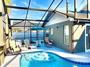 Poolside furniture and loungers and a spot for al fresco dining