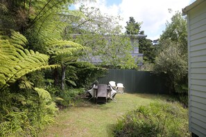 Back lawn area with outdoor furniture