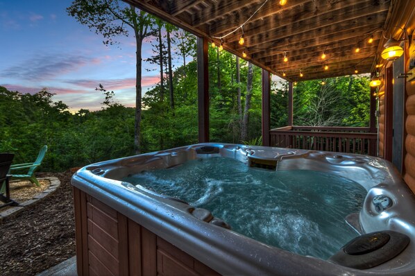 Hot Tub Retreat: Unwind under twinkling lights as nature wraps you in serenity!