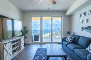 Sliding glass doors lead to private, over-sized balcony.