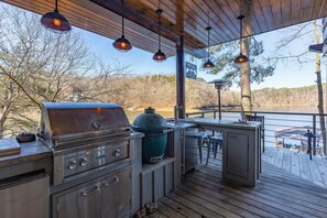Outdoor kitchen and bar area with Propane grill & Big Green Egg charcoal grill
