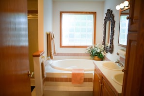 Jacuzzi-style tub in ground floor master bathroom.